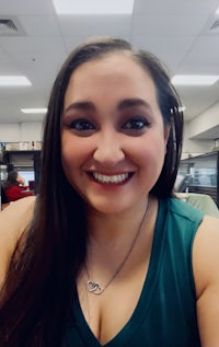 a woman smiling in an office